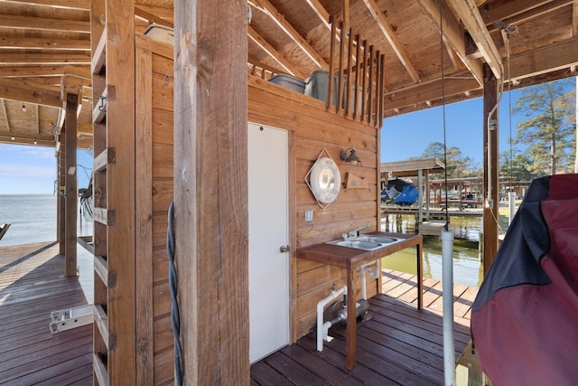 view of dock with a water view and sink