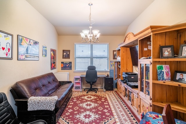 home office with lofted ceiling and a chandelier