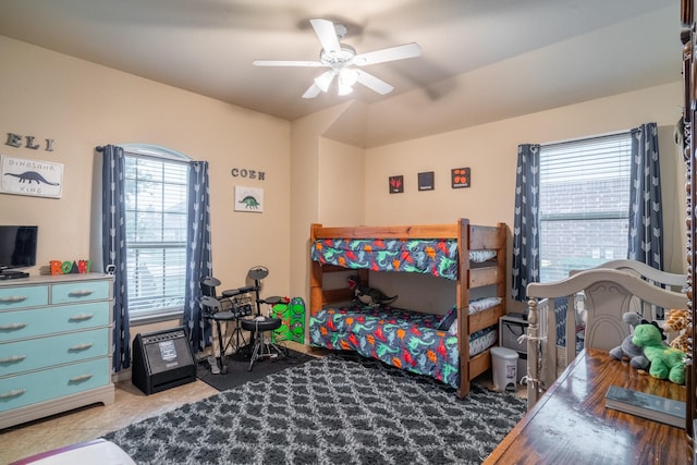 tiled bedroom with ceiling fan