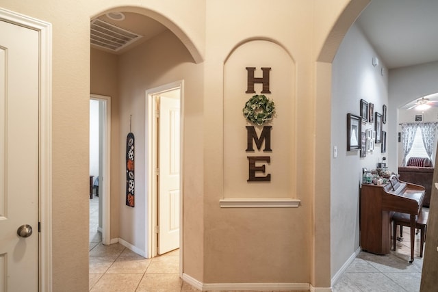 hallway with light tile patterned flooring