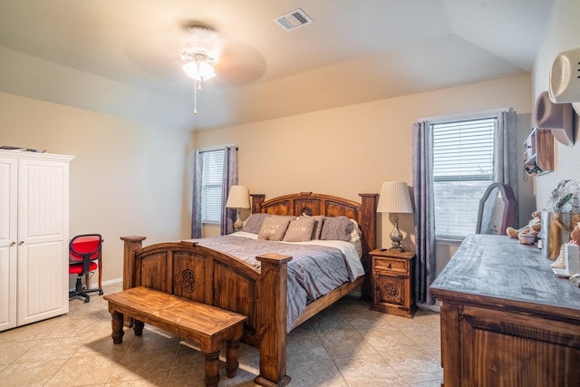 bedroom with multiple windows and ceiling fan