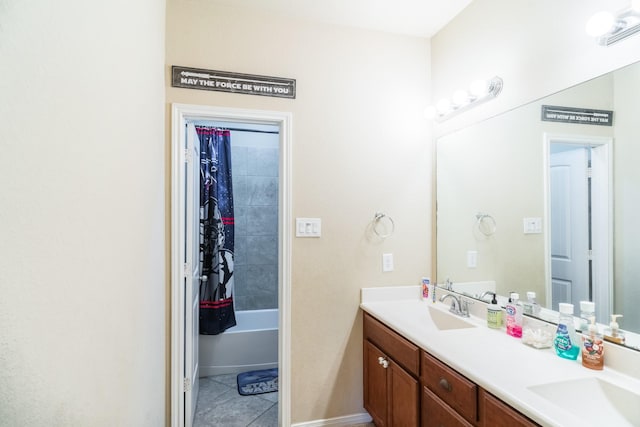 bathroom with tile patterned flooring, vanity, and tiled shower / bath combo