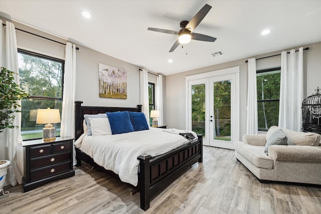 bedroom with access to outside, ceiling fan, french doors, and light hardwood / wood-style flooring