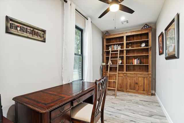 home office with ceiling fan and light wood-type flooring