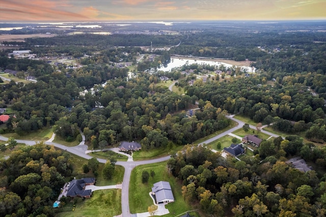 aerial view at dusk with a water view