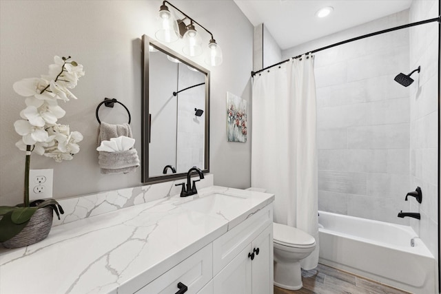 full bathroom with toilet, wood-type flooring, vanity, and shower / tub combo with curtain