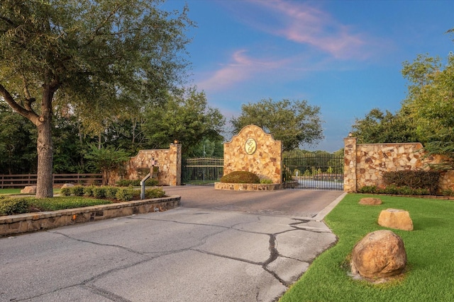 view of gate at dusk