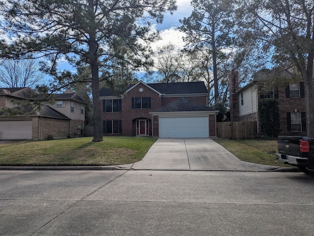 view of front of home featuring a garage and a front yard