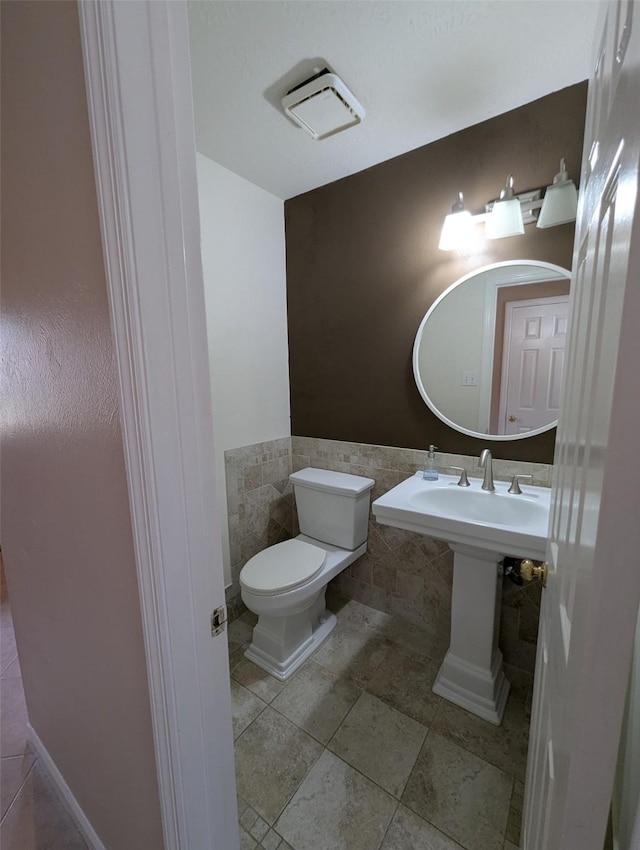 bathroom featuring toilet