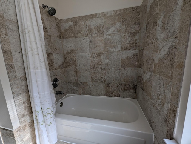 bathroom with shower / tub combo with curtain