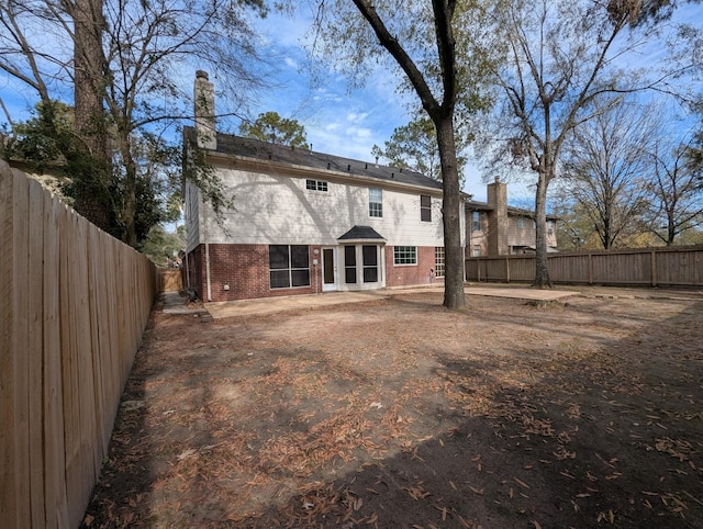 rear view of house featuring a patio