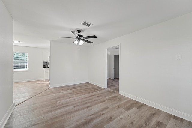 spare room with light hardwood / wood-style flooring and ceiling fan