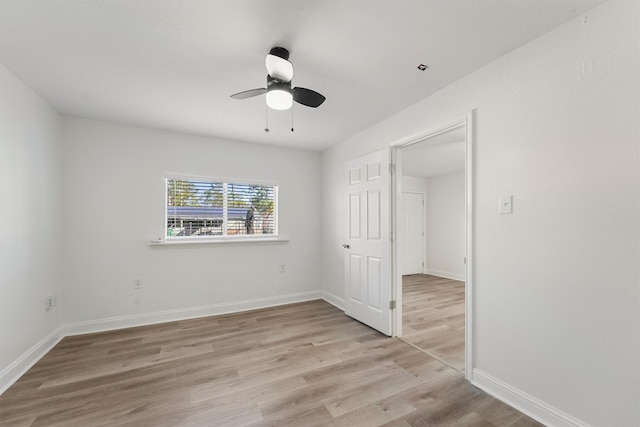 unfurnished bedroom featuring ceiling fan and light hardwood / wood-style floors