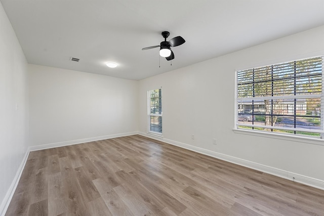 unfurnished room with light hardwood / wood-style flooring and ceiling fan