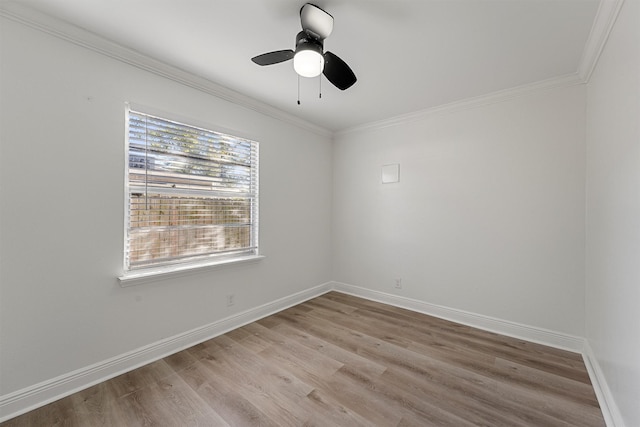 spare room with crown molding, ceiling fan, and light hardwood / wood-style floors