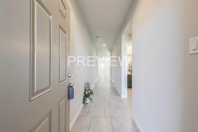 hall featuring light tile patterned floors