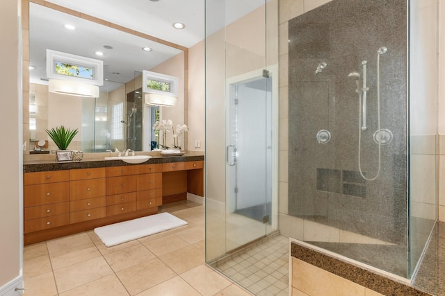 bathroom with tile patterned flooring, vanity, and an enclosed shower