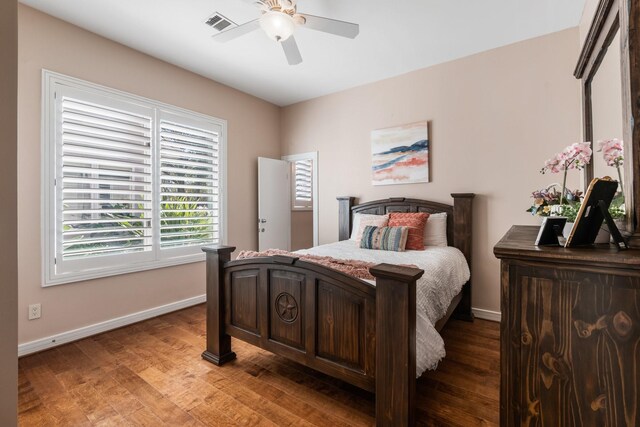 bedroom with ceiling fan and wood-type flooring