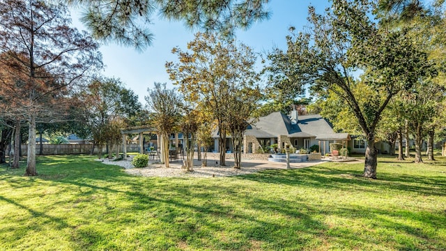 view of yard with a pergola and a patio