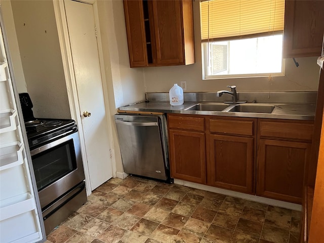 kitchen featuring stainless steel counters, sink, and stainless steel appliances