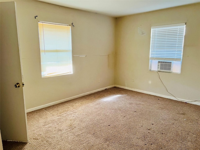 carpeted spare room featuring cooling unit