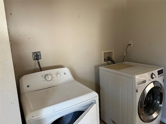 clothes washing area featuring washing machine and dryer