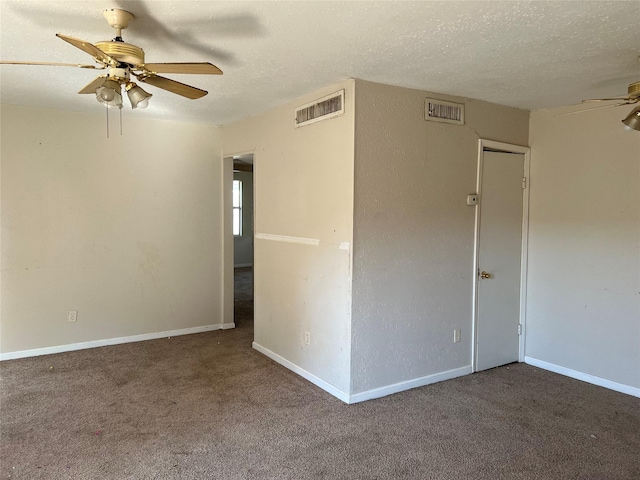 spare room with ceiling fan, carpet floors, and a textured ceiling