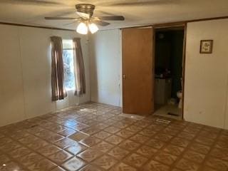 spare room featuring ceiling fan