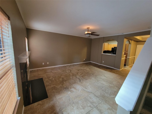 unfurnished living room with ceiling fan