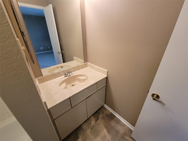 bathroom featuring tile patterned flooring and vanity