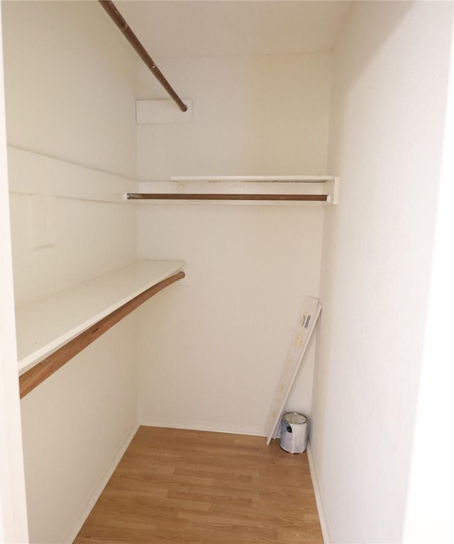 walk in closet featuring hardwood / wood-style floors