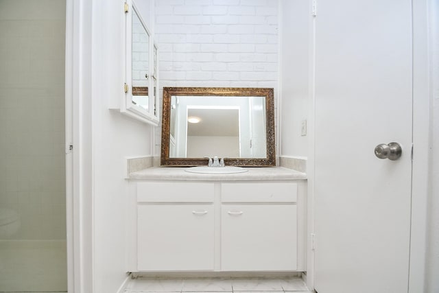 bathroom with tile patterned flooring and vanity