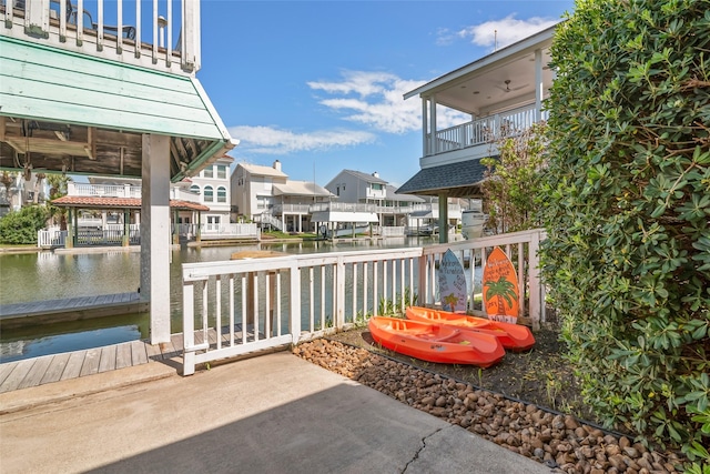 view of patio / terrace featuring a water view and a balcony