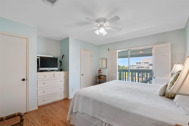 bedroom featuring access to exterior, ceiling fan, and light hardwood / wood-style floors