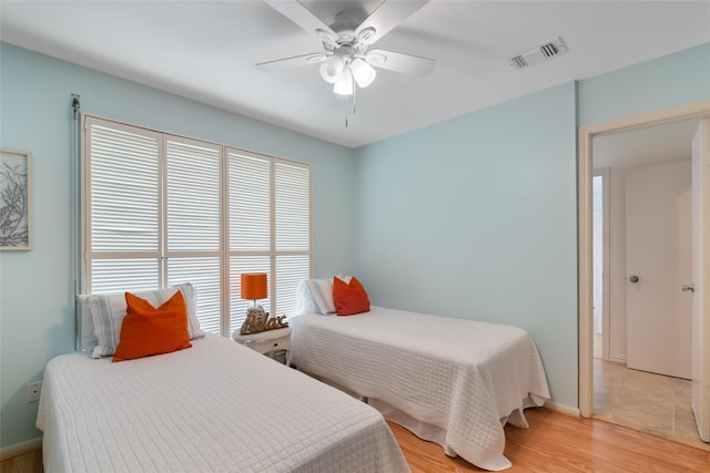 bedroom featuring light wood-type flooring and ceiling fan