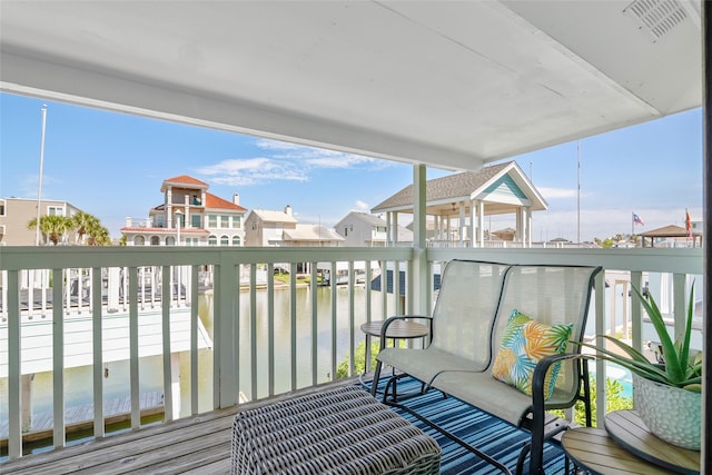 balcony featuring a water view