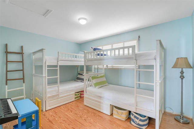 bedroom with hardwood / wood-style floors