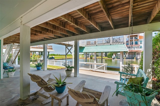 view of patio with a water view