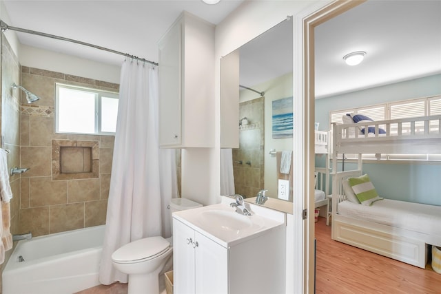 full bathroom with wood-type flooring, vanity, toilet, and shower / bath combo