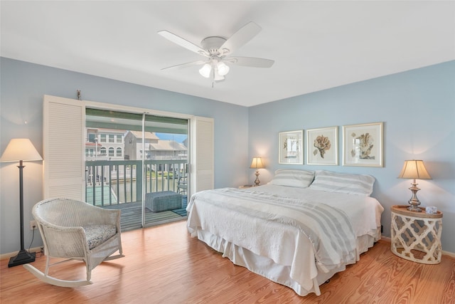 bedroom featuring light wood-type flooring, access to outside, and ceiling fan