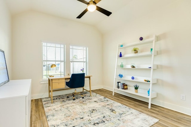 office area with light hardwood / wood-style flooring, ceiling fan, and lofted ceiling