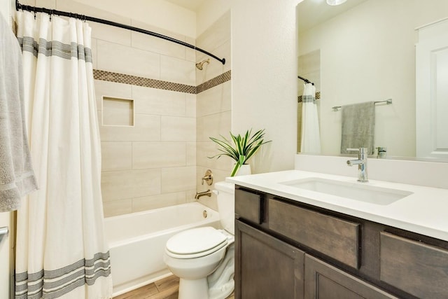 full bathroom with shower / tub combo, vanity, hardwood / wood-style flooring, and toilet