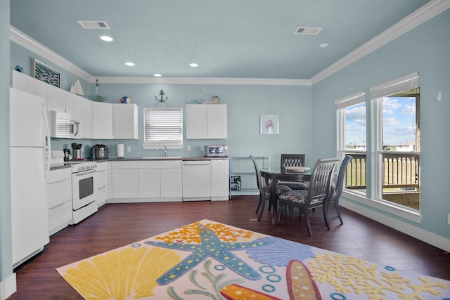 kitchen featuring white cabinetry, sink, crown molding, and white appliances