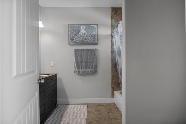 bathroom with vanity and shower / bath combo