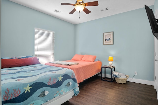 bedroom featuring ceiling fan and dark hardwood / wood-style floors