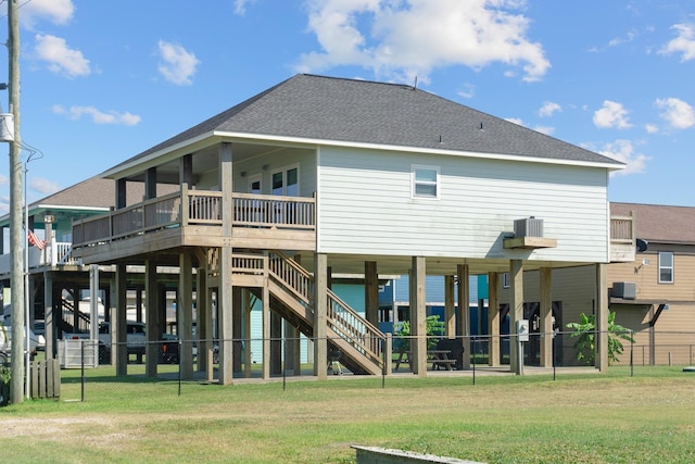 rear view of property with a lawn