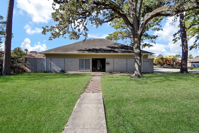 ranch-style home with a front lawn