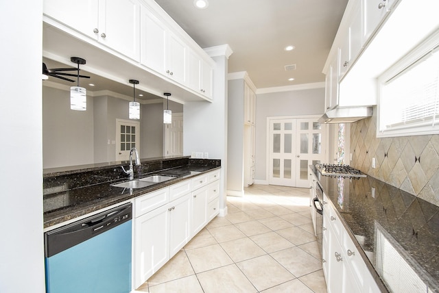 kitchen featuring dark stone countertops, white cabinets, and appliances with stainless steel finishes