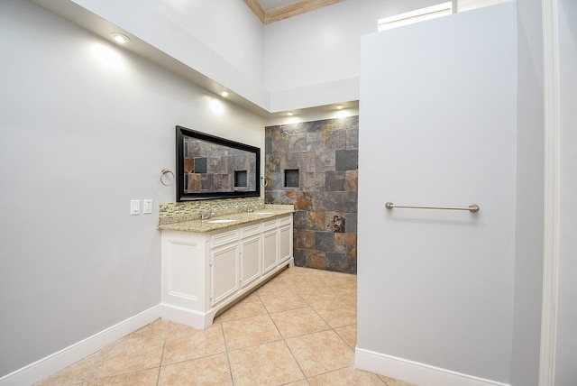 bathroom with tile patterned flooring and vanity