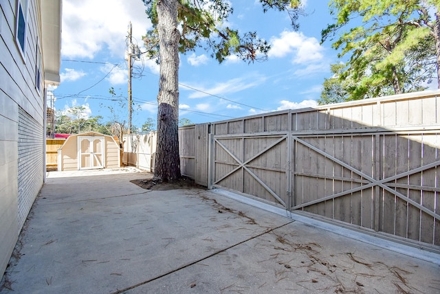 view of gate with a storage shed